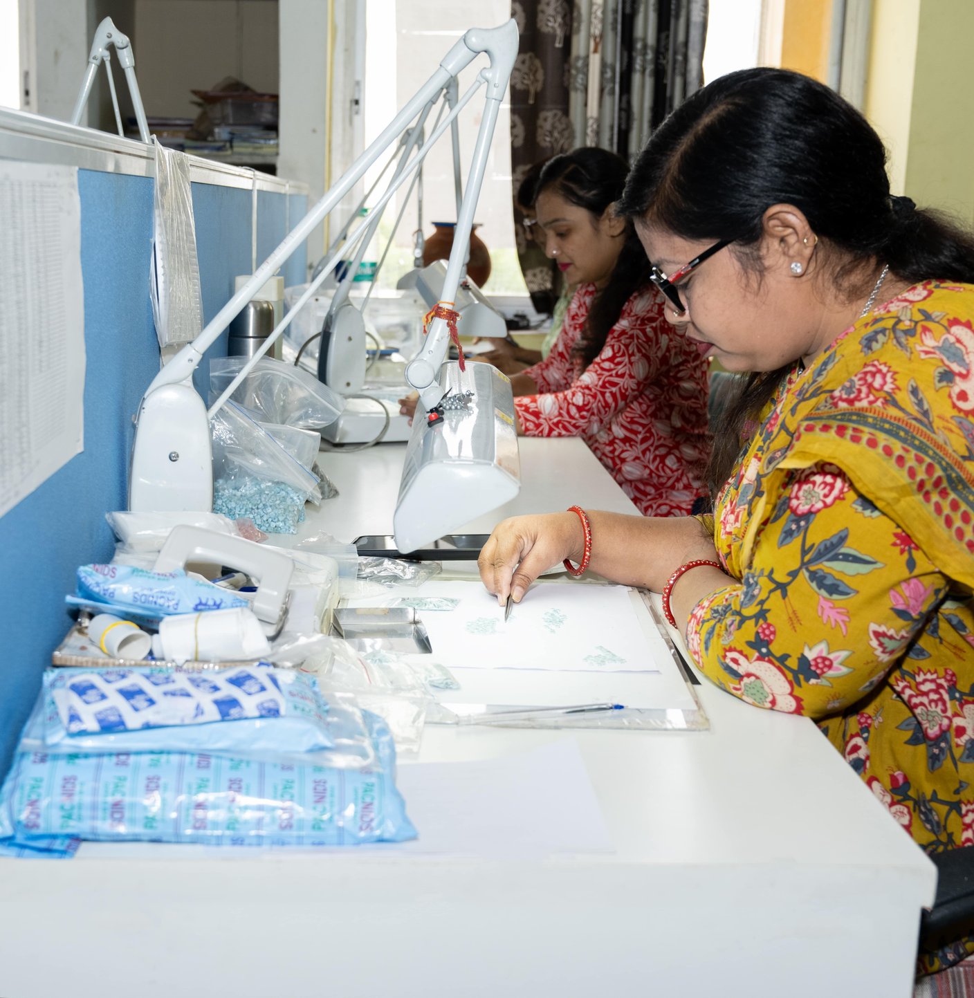 Women artisans crafting silver jewelry at Blazels